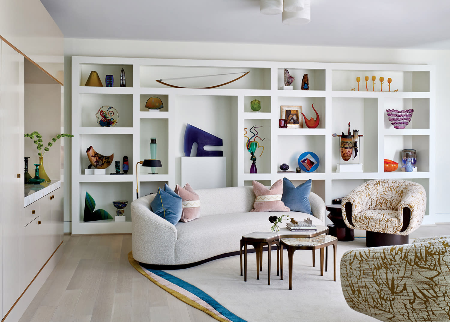 modern, bright galleria displaying the homeowners' glass art collection