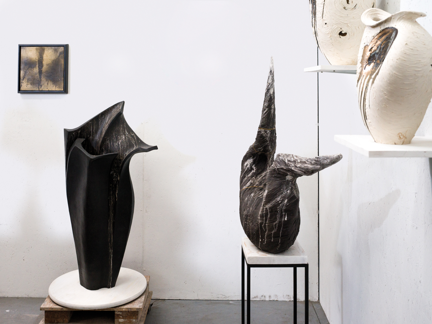 Two dark-clay pieces by Beverly Morrison