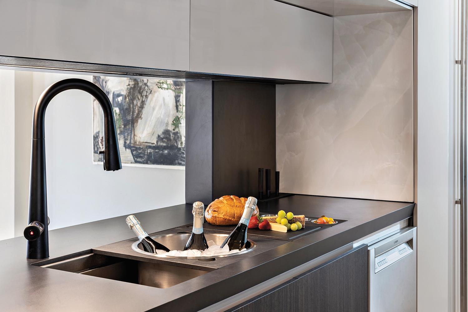 Matte black Zip HydroTap Arc Plus faucet in the Pazzam Project kitchen, delivering boiling, chilled, and sparkling water in a sculptural, minimalist form.