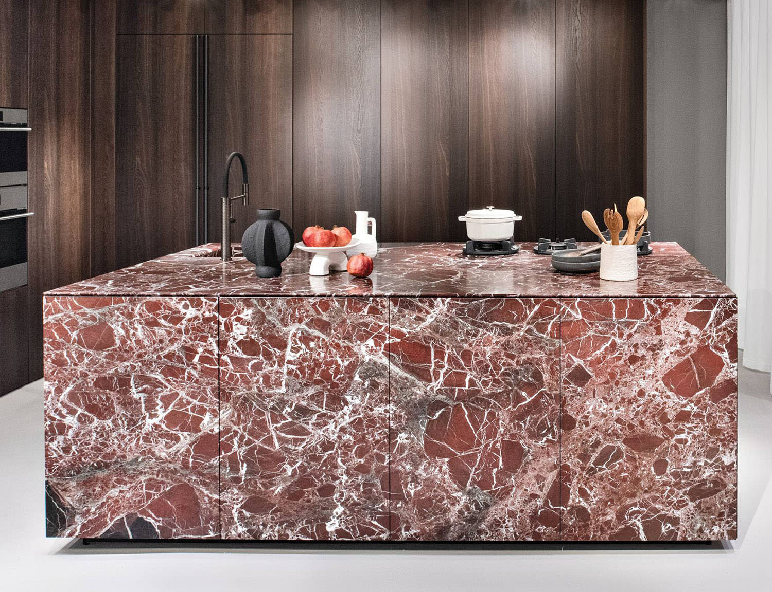 red marble kitchen island on display at Cesar's Miami showroom