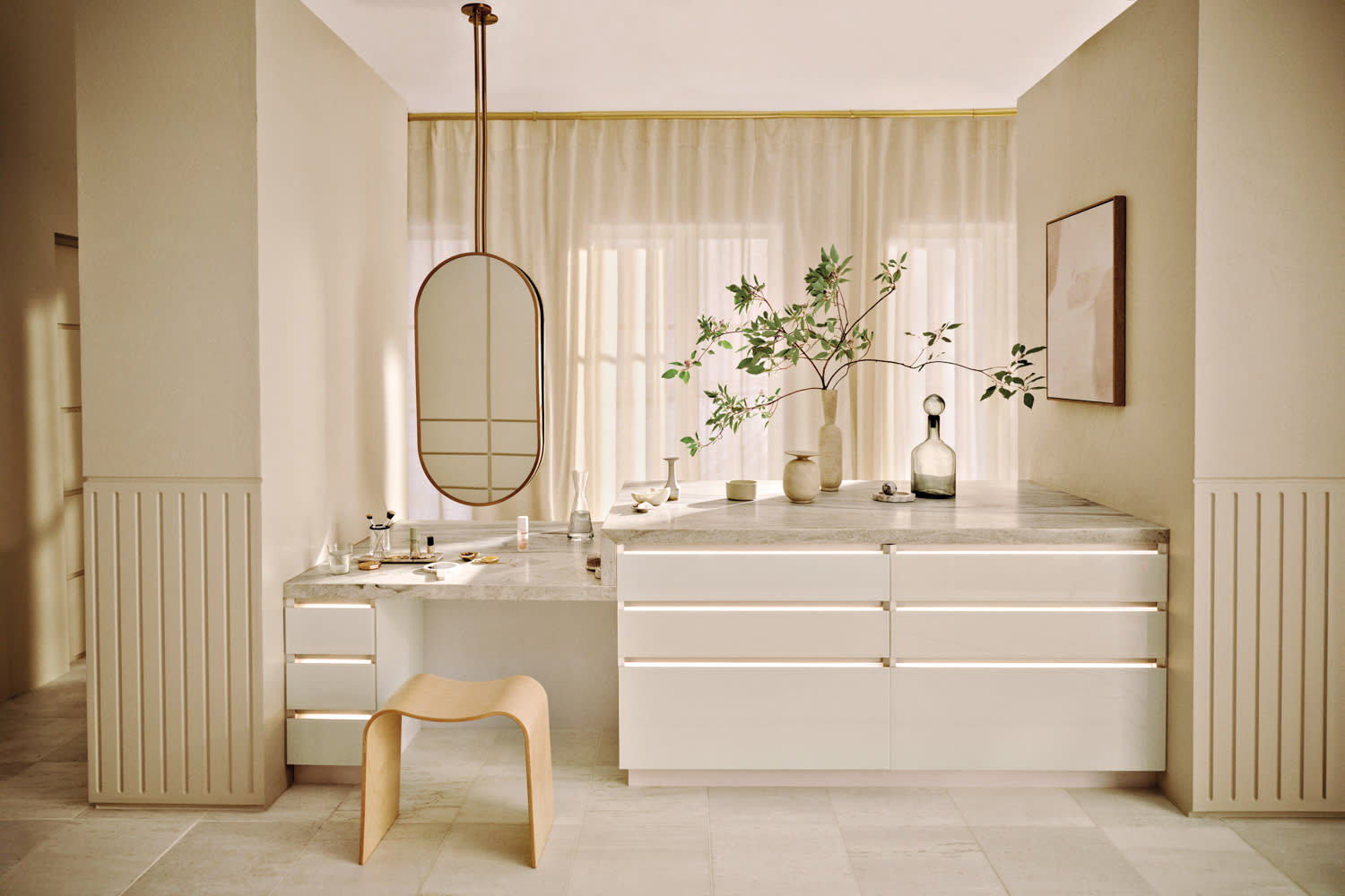 oval-shaped hanging mirror in a white modern bathroom
