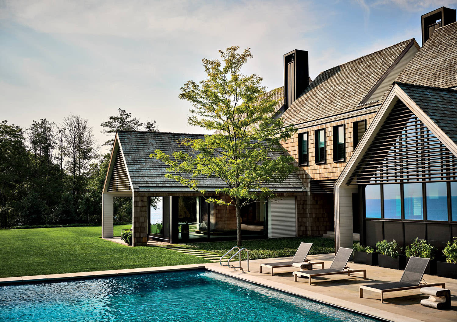 cedar-clad home with a pool 