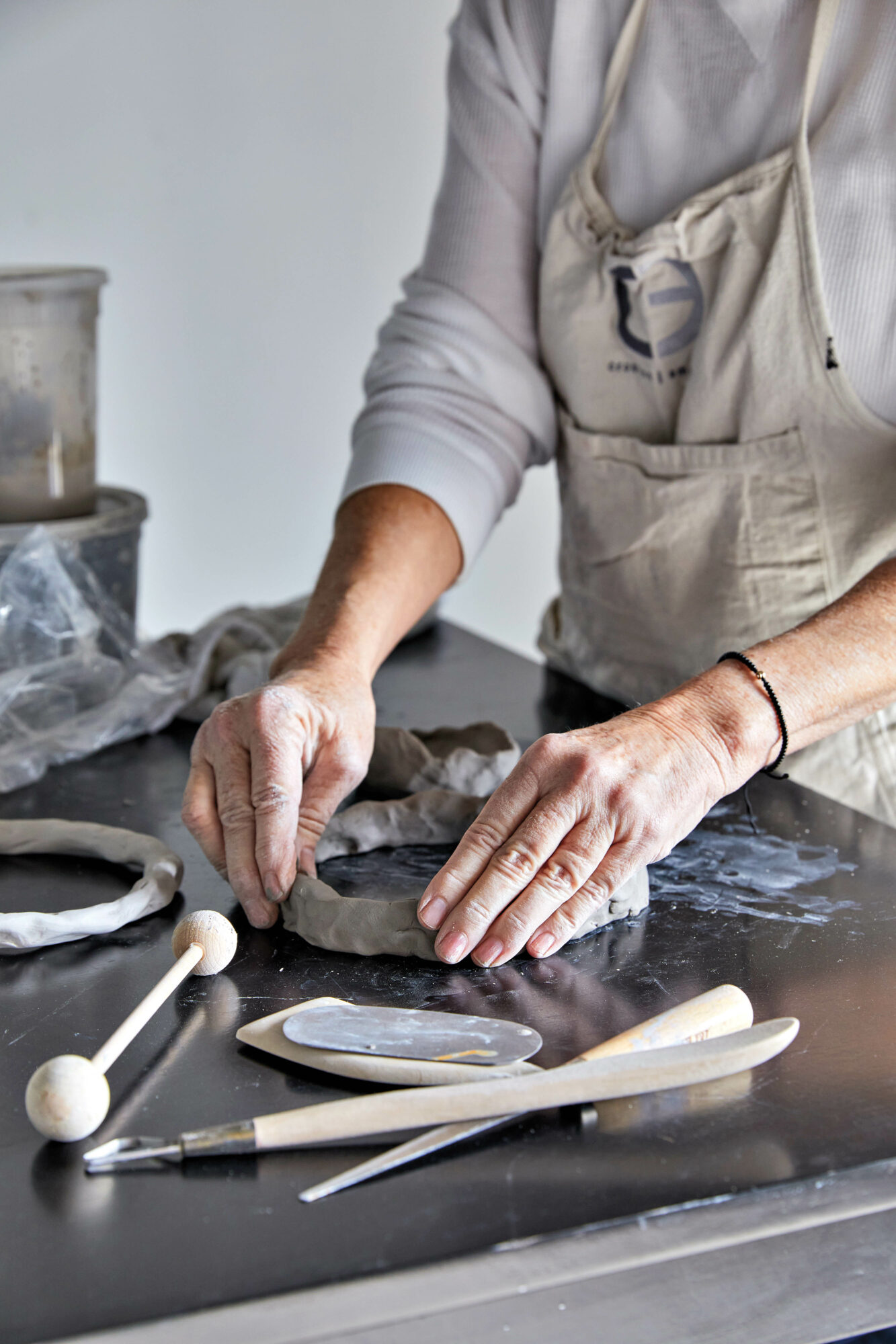 Dana Castle shaping clay by hand