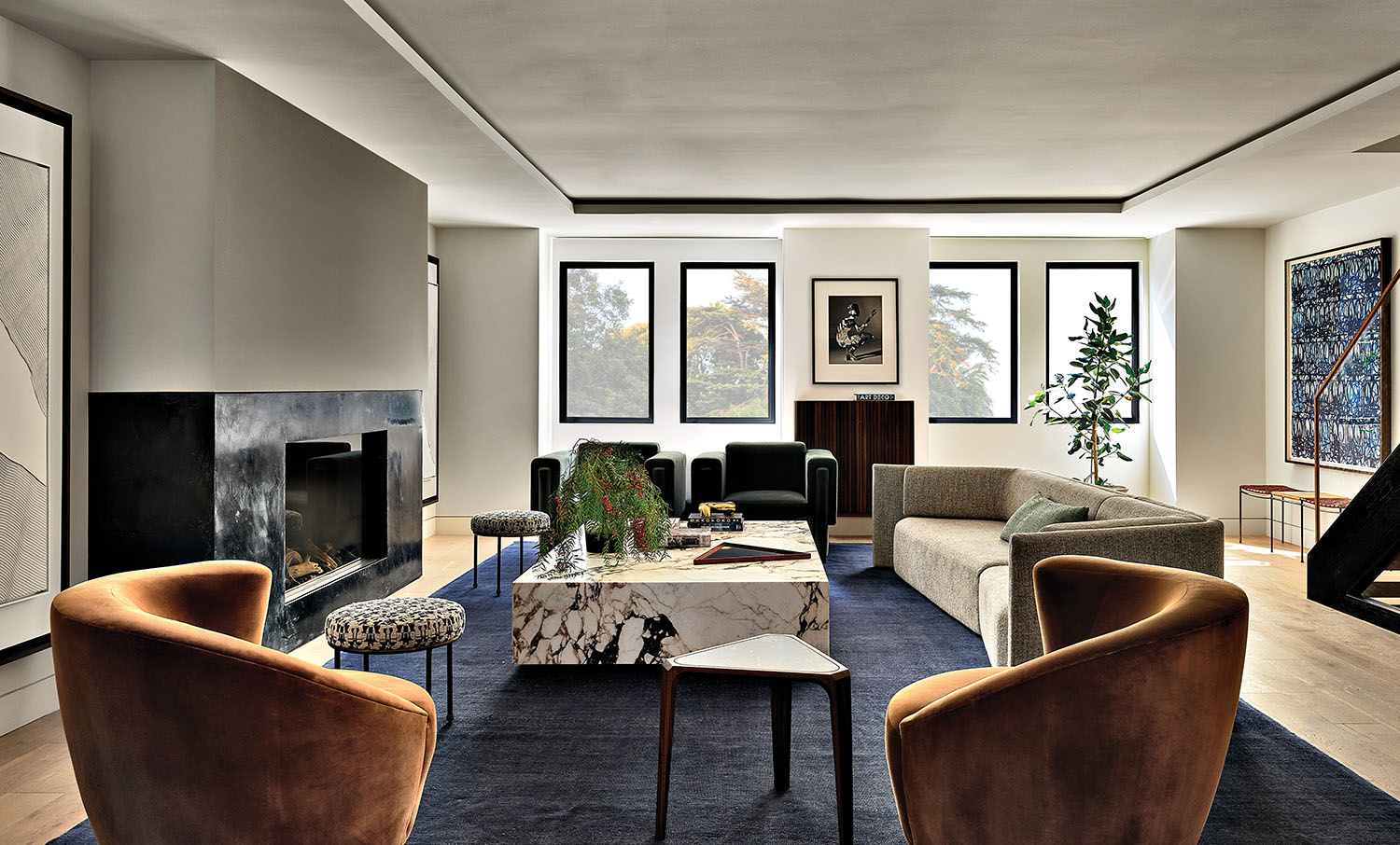 modern living room of a San Francisco home with curving orange swivel chairs