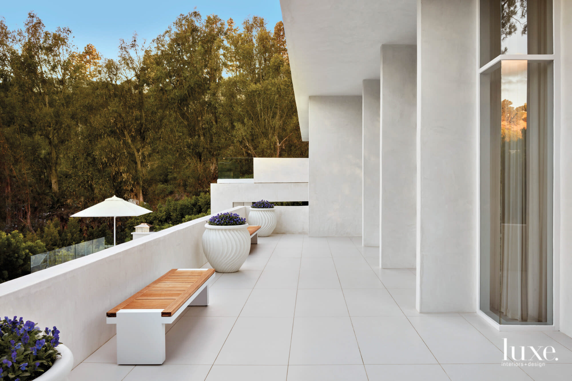 Exterior terrace shot with bench and planters