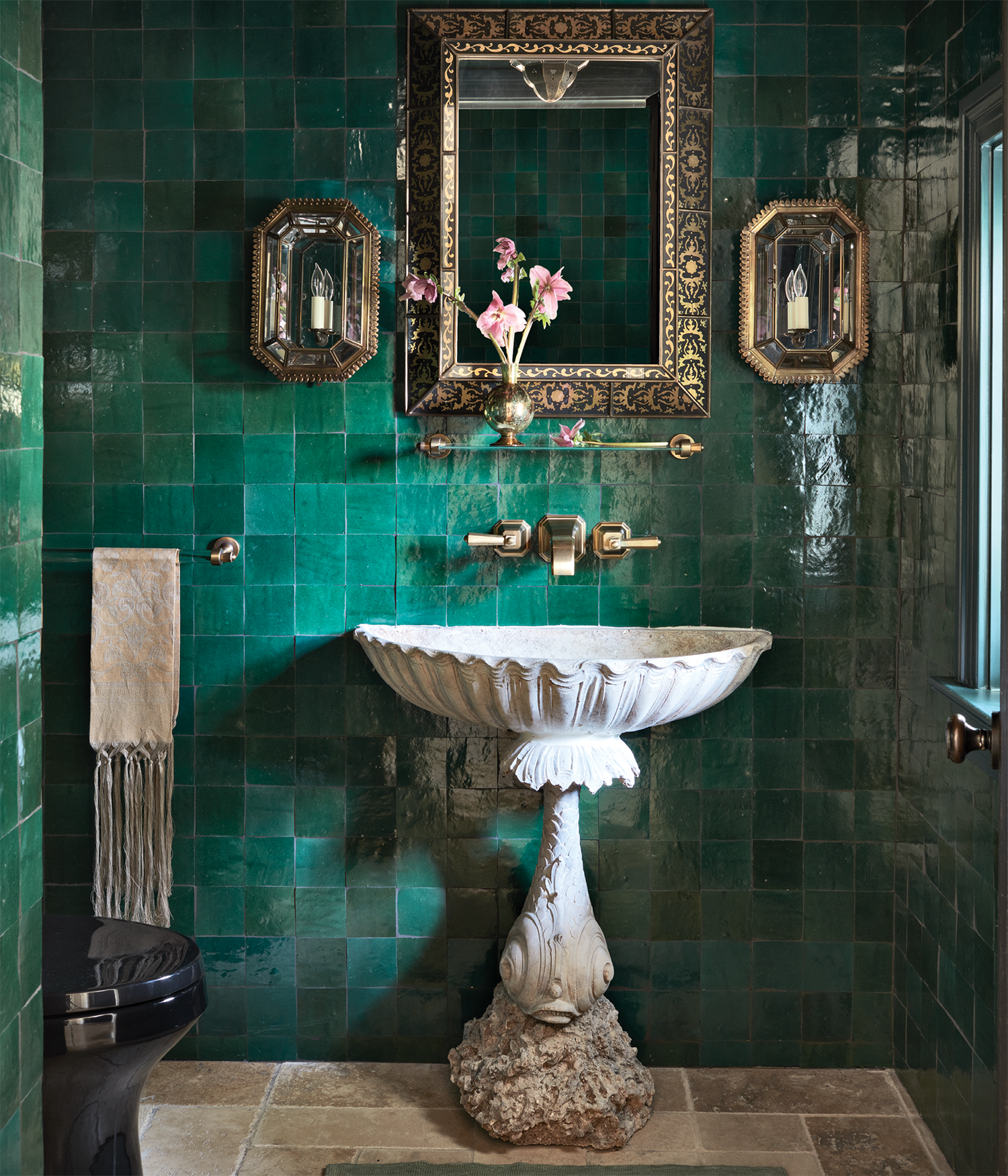classic powder room with green tiles and a pedestal sink