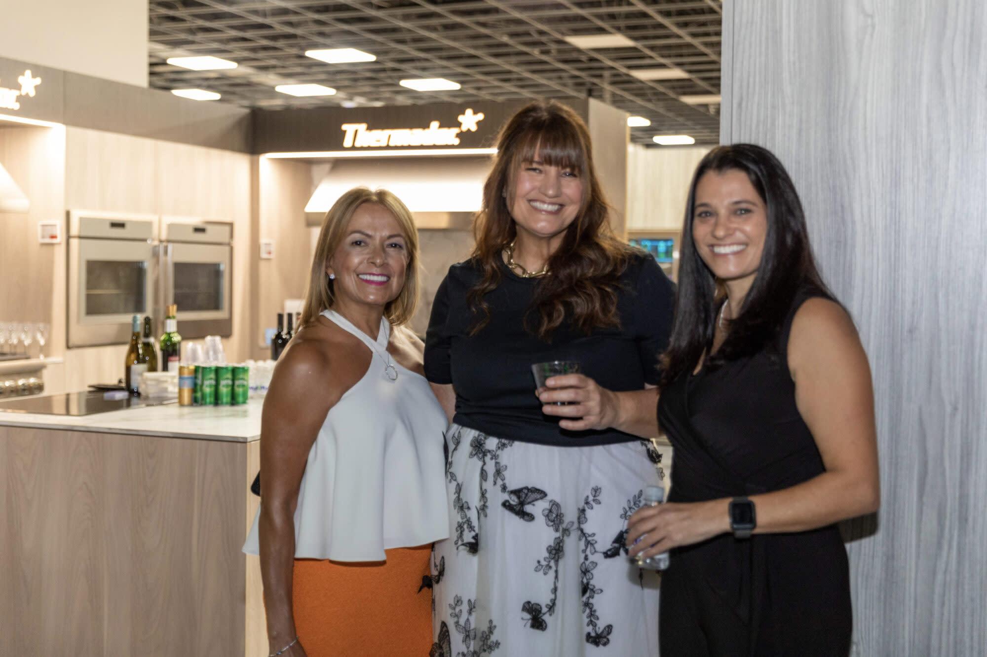 three ladies standing together