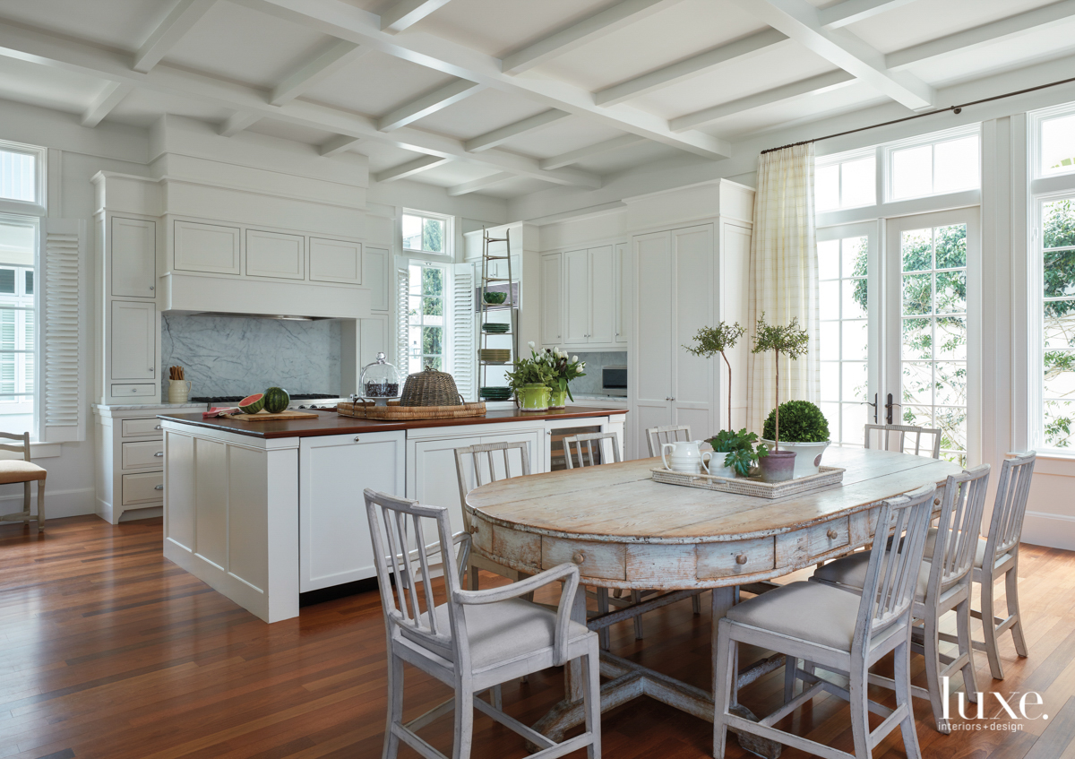 antique whitewashed pine table in kitchen with walnut countertops