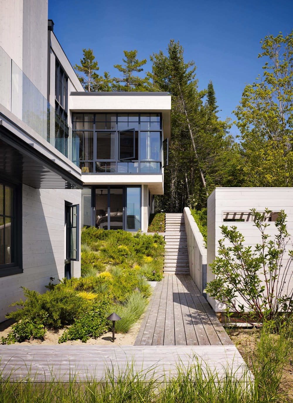 Walkway and stairs to this multilevel home.