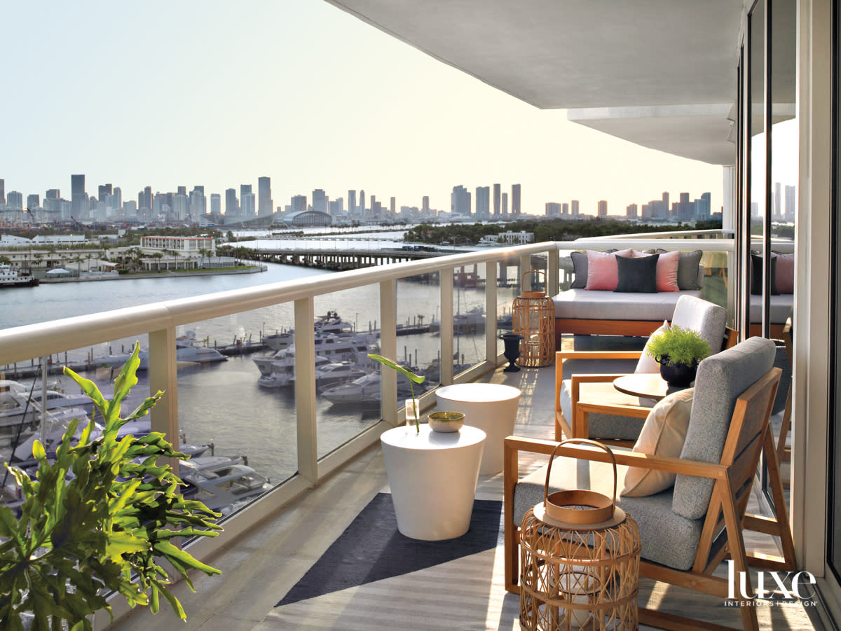 balcony with city view, chairs, stools and daybed