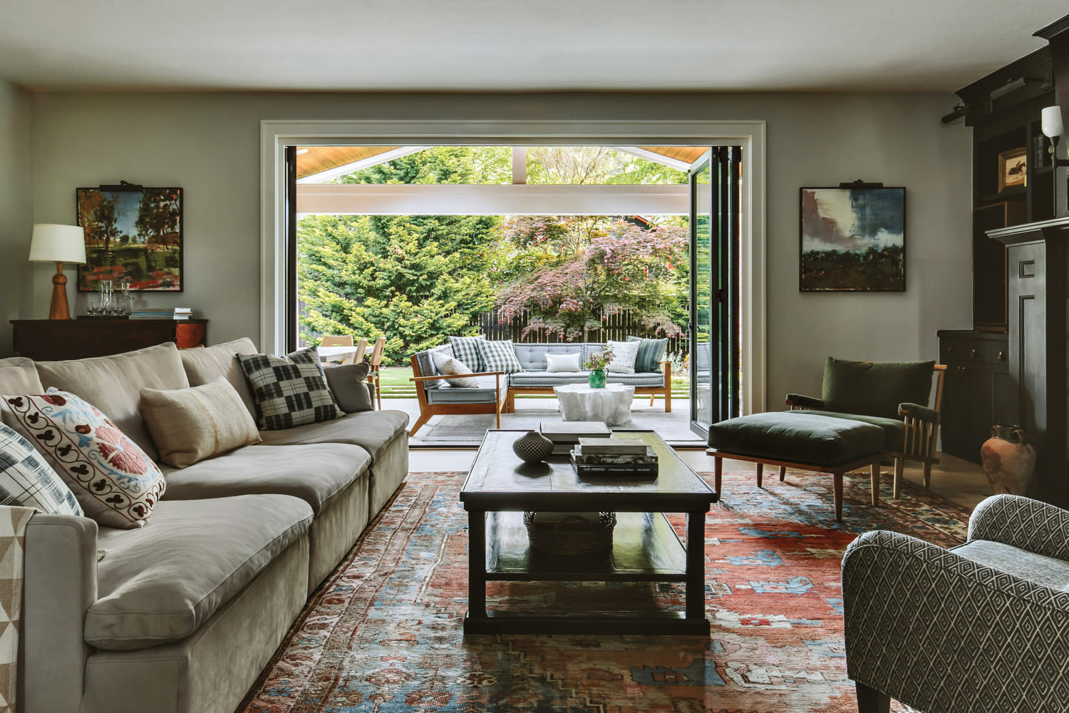 cozy, traditional living room with a red rug