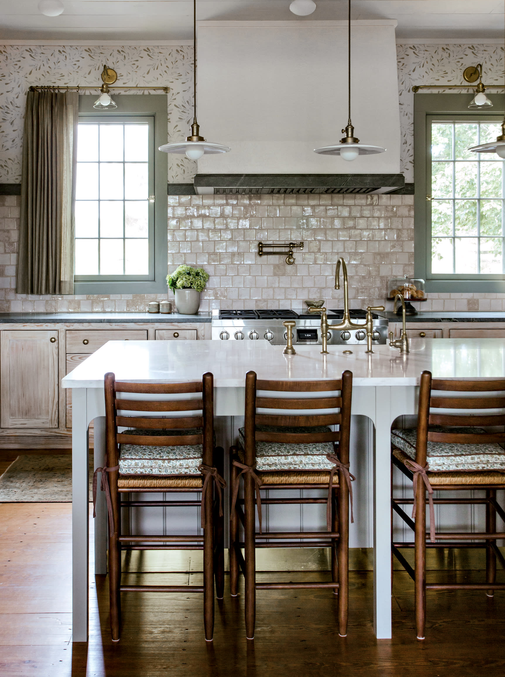 farmhouse kitchen with gold fixtures and wood accents