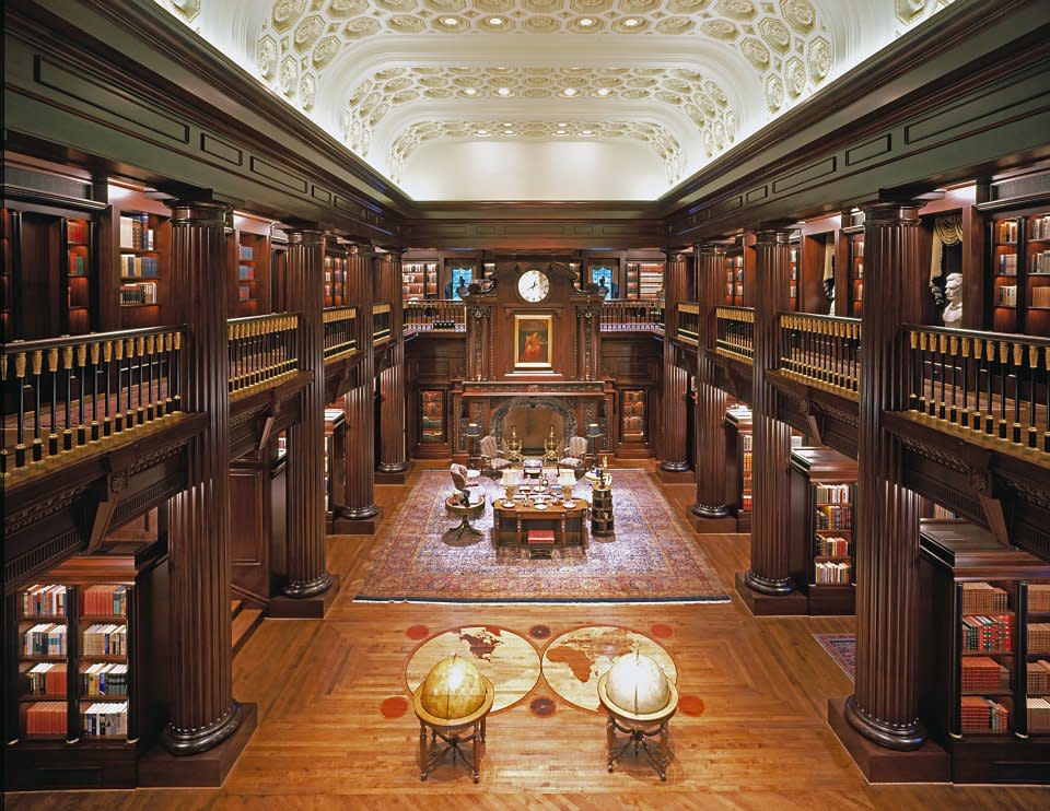 Ornate and intricate ceiling with green olive paint and warm woodwork