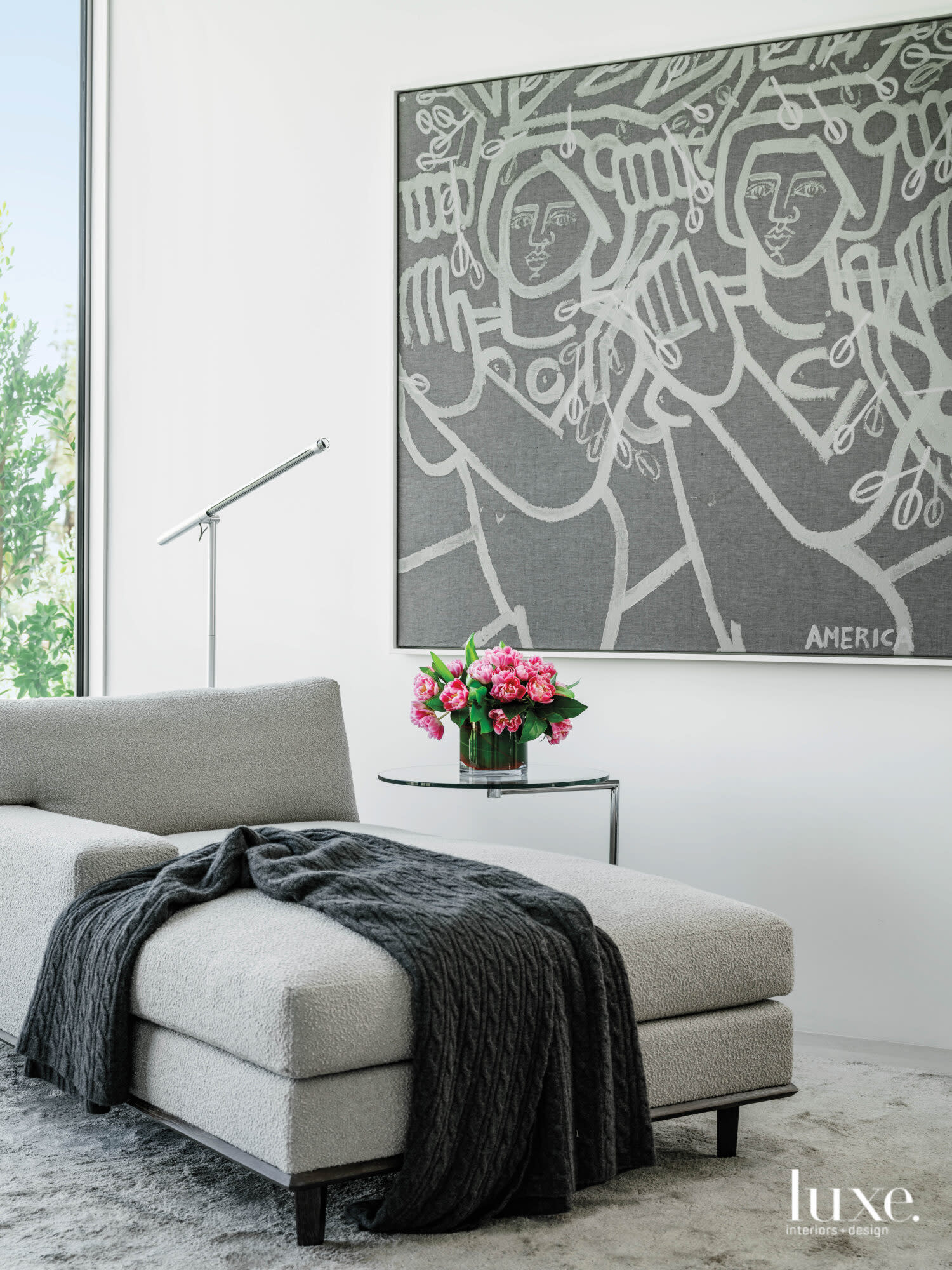 Detail of master bedroom with lounge chair and America Martin painting