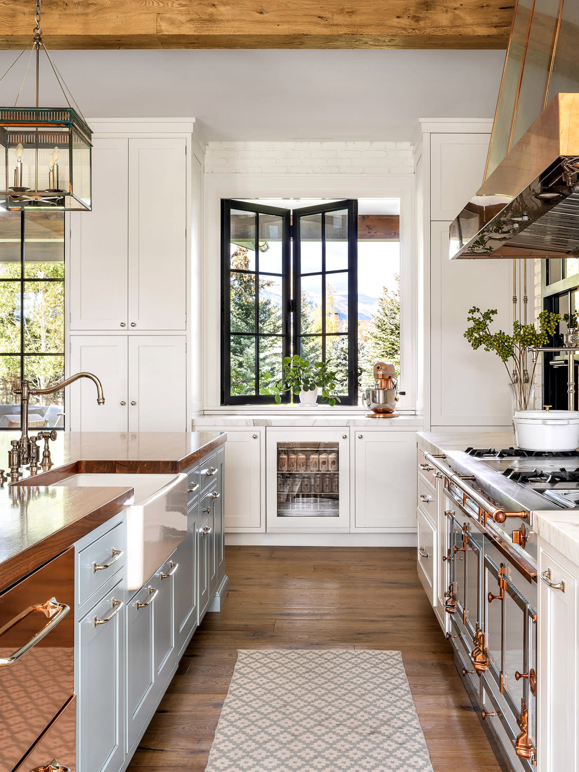 kitchen with copper details and blue cabinetry