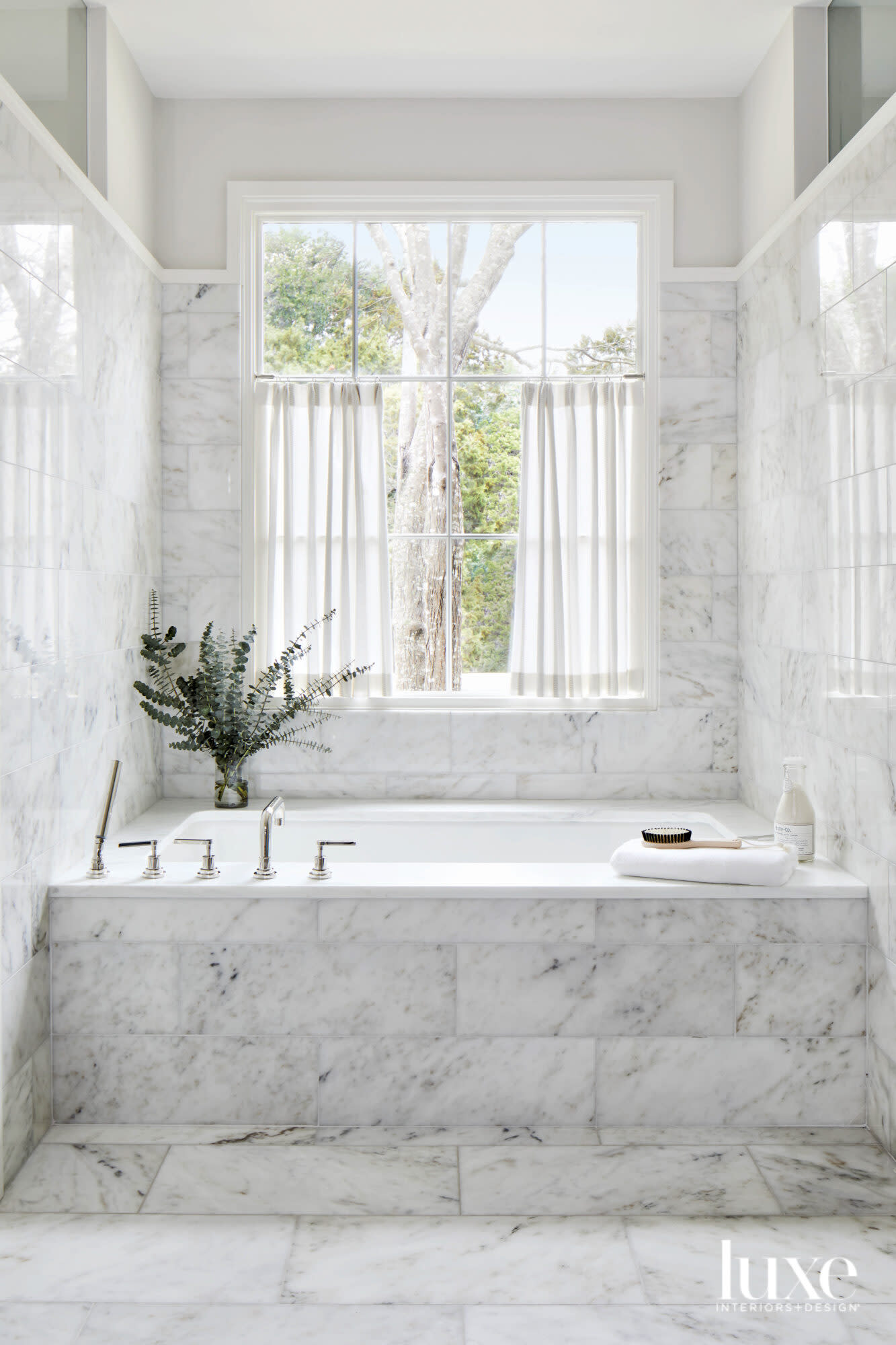 Marble-clad tub area.