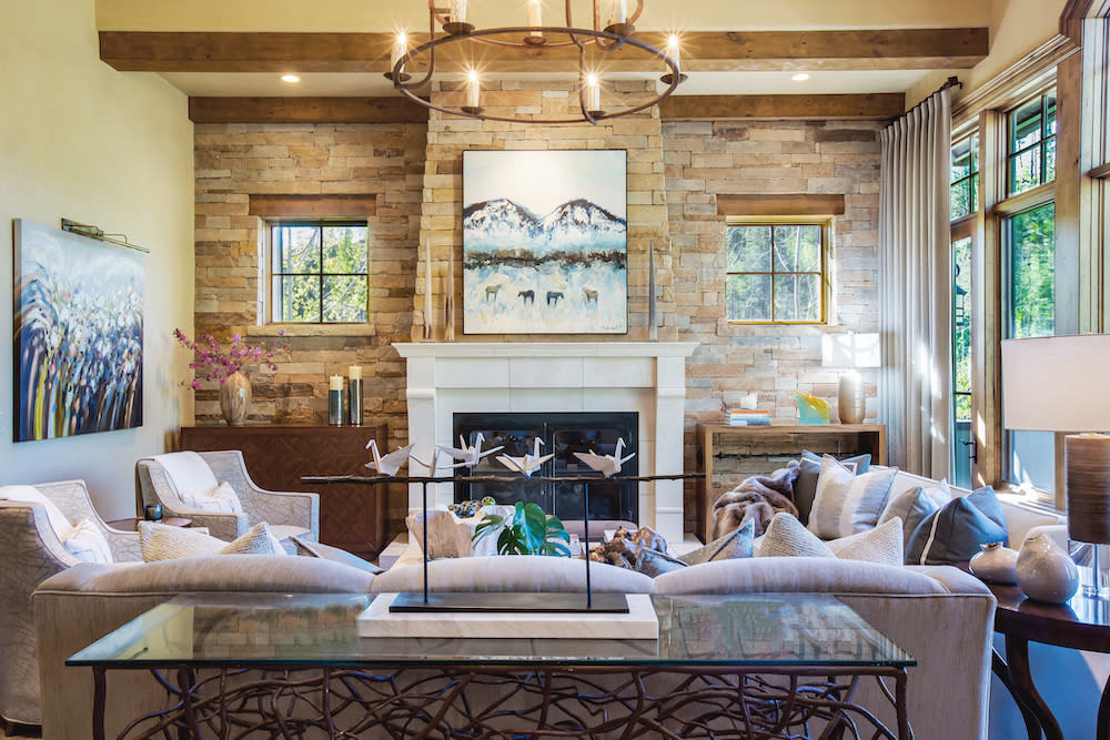 Cozy family room with a statement rock wall and fireplace