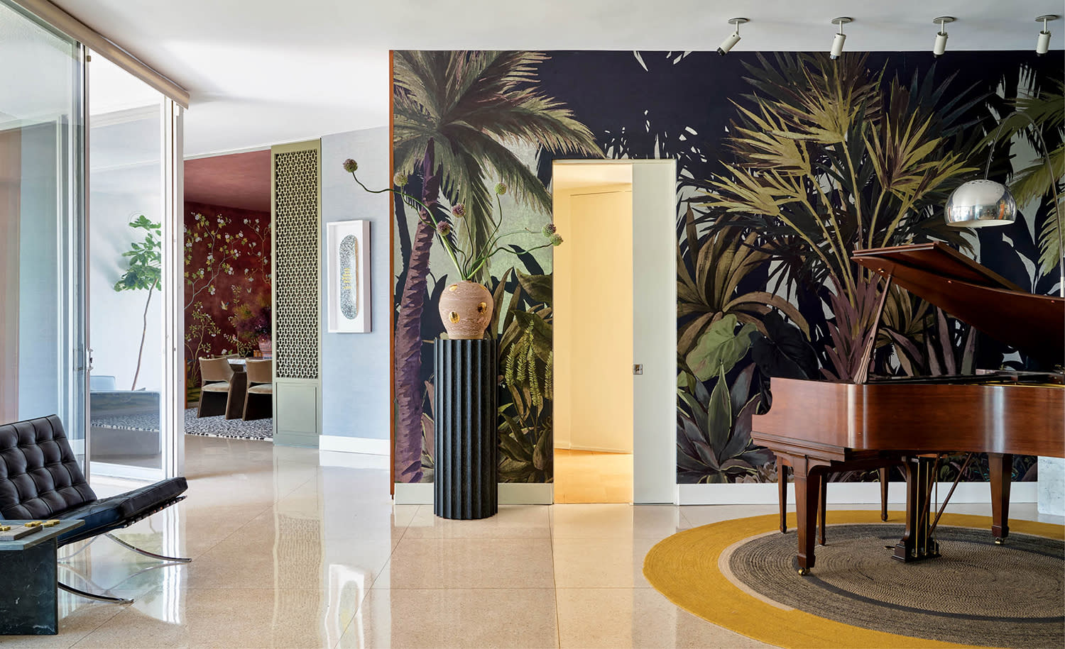 midcentury modern home's entryway with a tropical mural wallcovering behind a piano