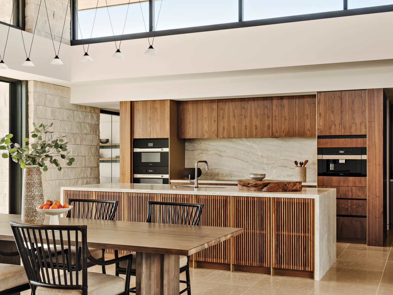 open concept kitchen with walnut casework