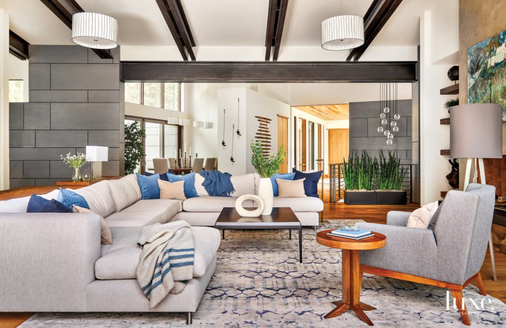 living room with beams and sectional