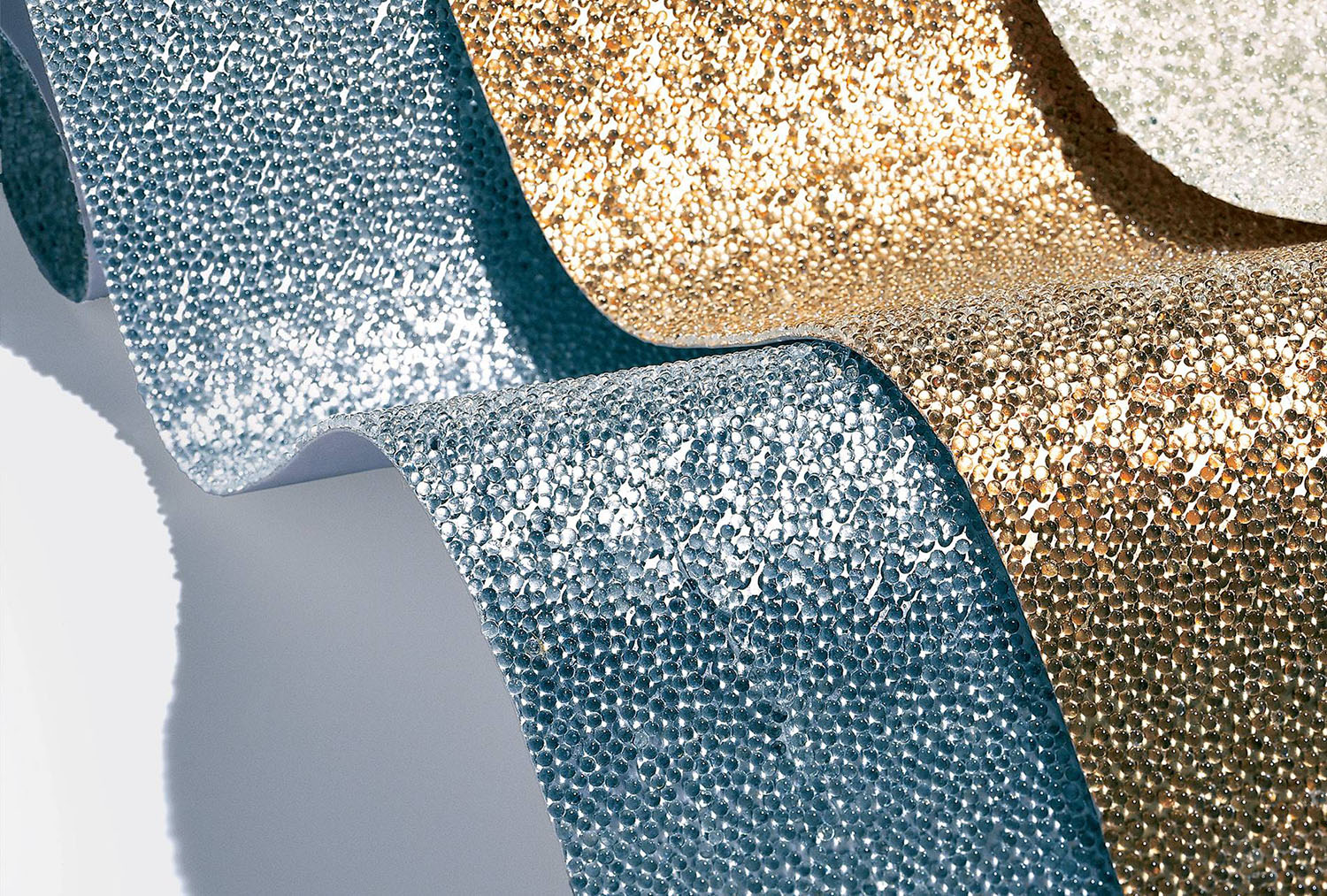 blue and gold iridescent wallpapers by Maya Romanoff