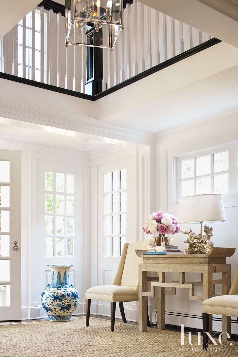 Traditional White Foyer with Floor Vase | LUXE Interiors + Design, image size:960x1440