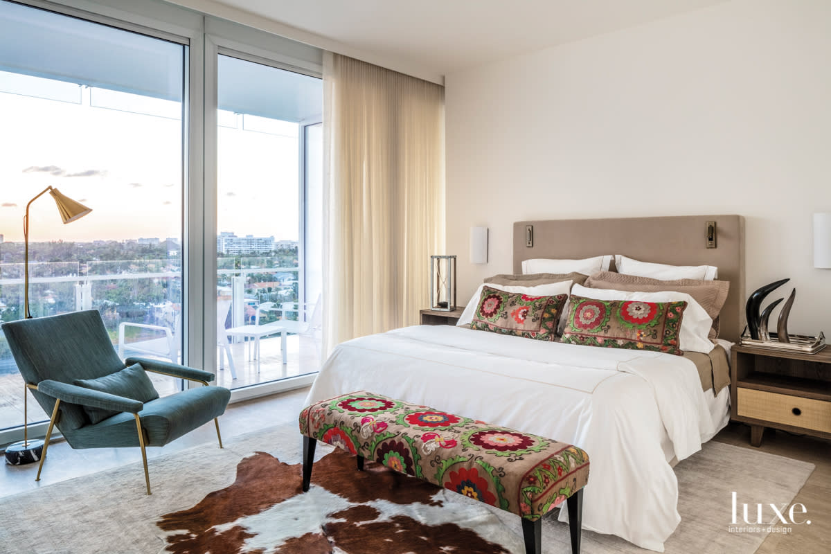 guest bedroom with accent fabrics and cowhide rug