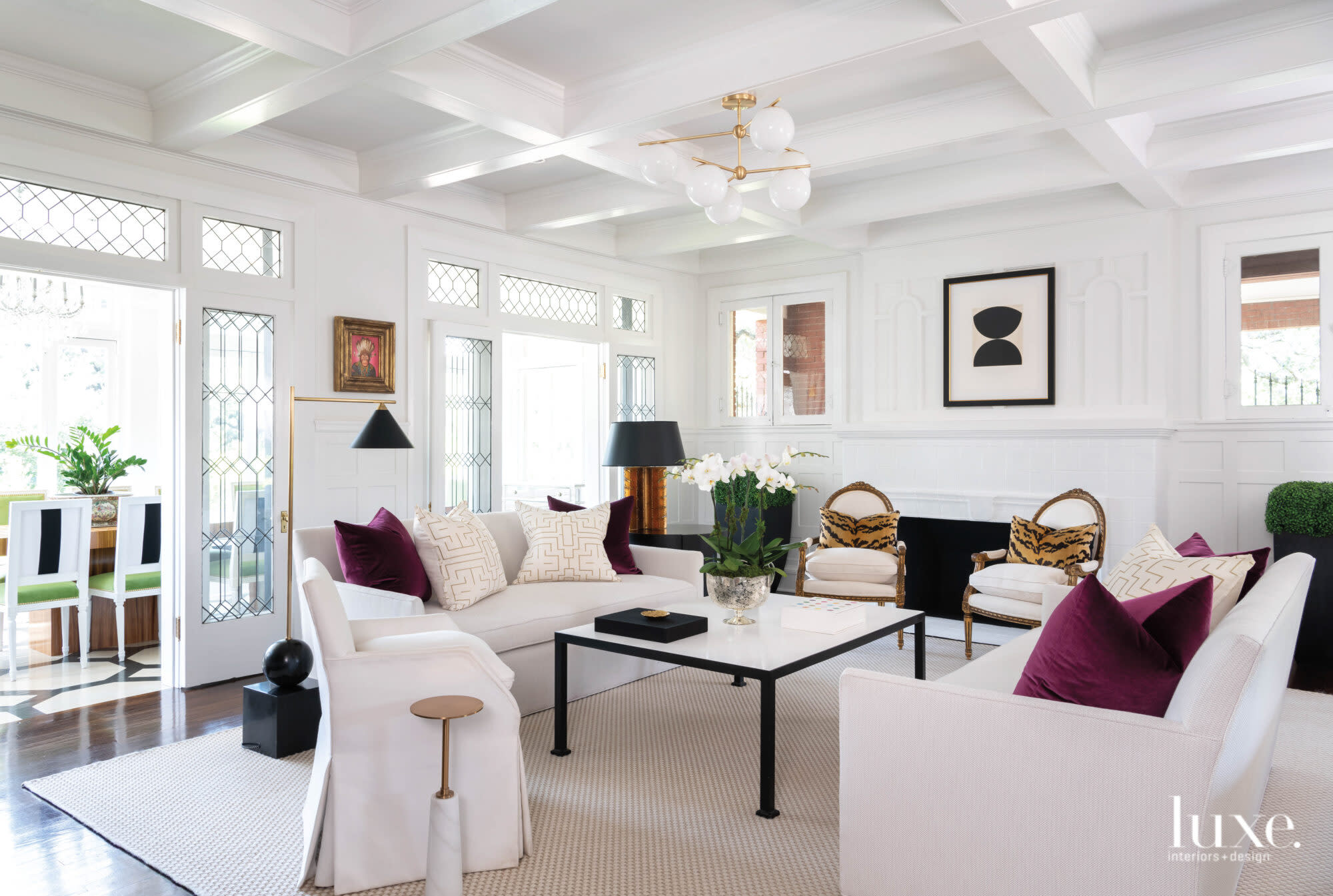 Living room with tailored furnishings and paneled cielings