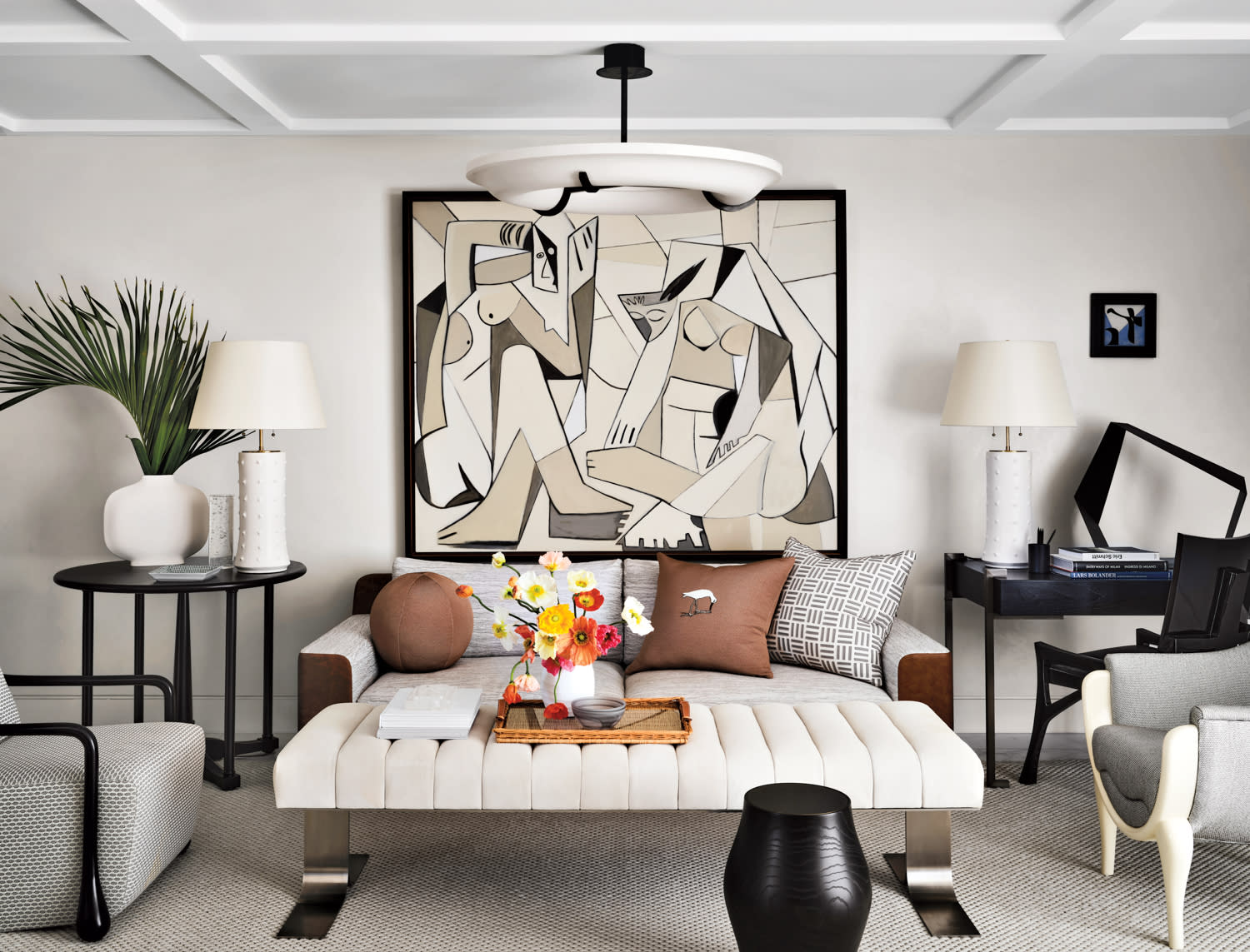 living area with George Williamson painting, gray-and-brown sofa, tufted bench and gray armchairs