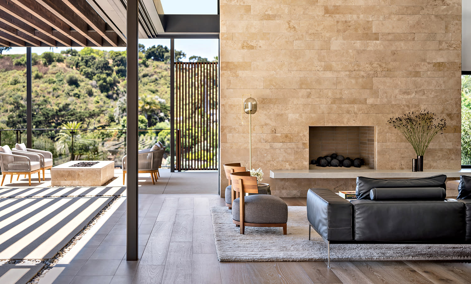 indoor-outdoor great room with slider pocket doors and a trellis