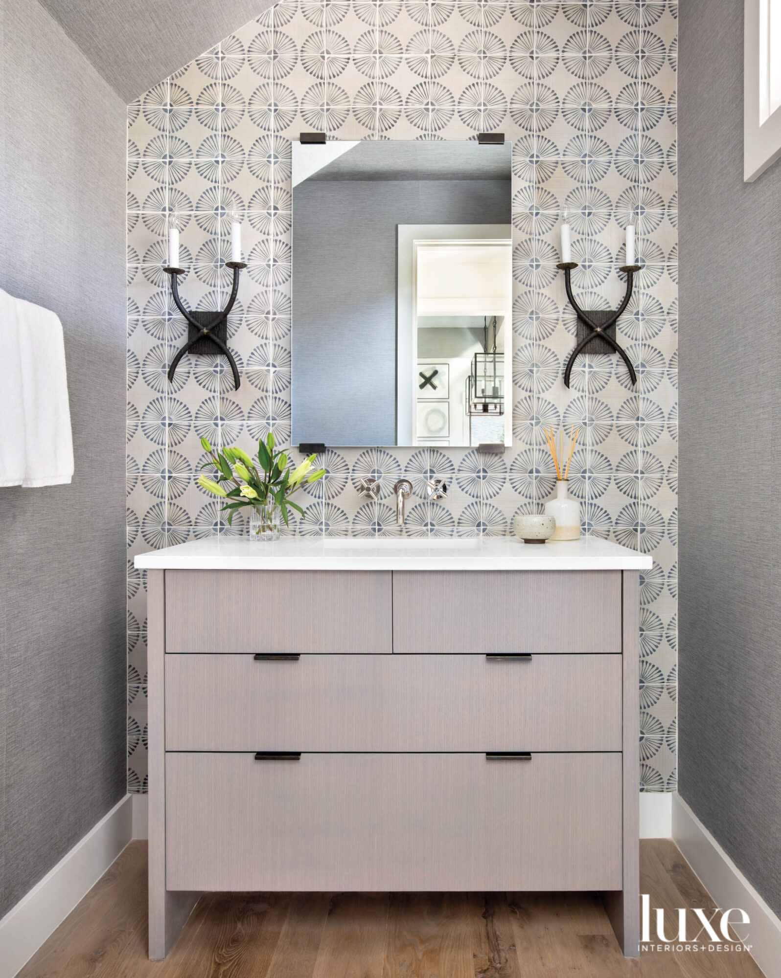 Powder room with handprinted wall tile