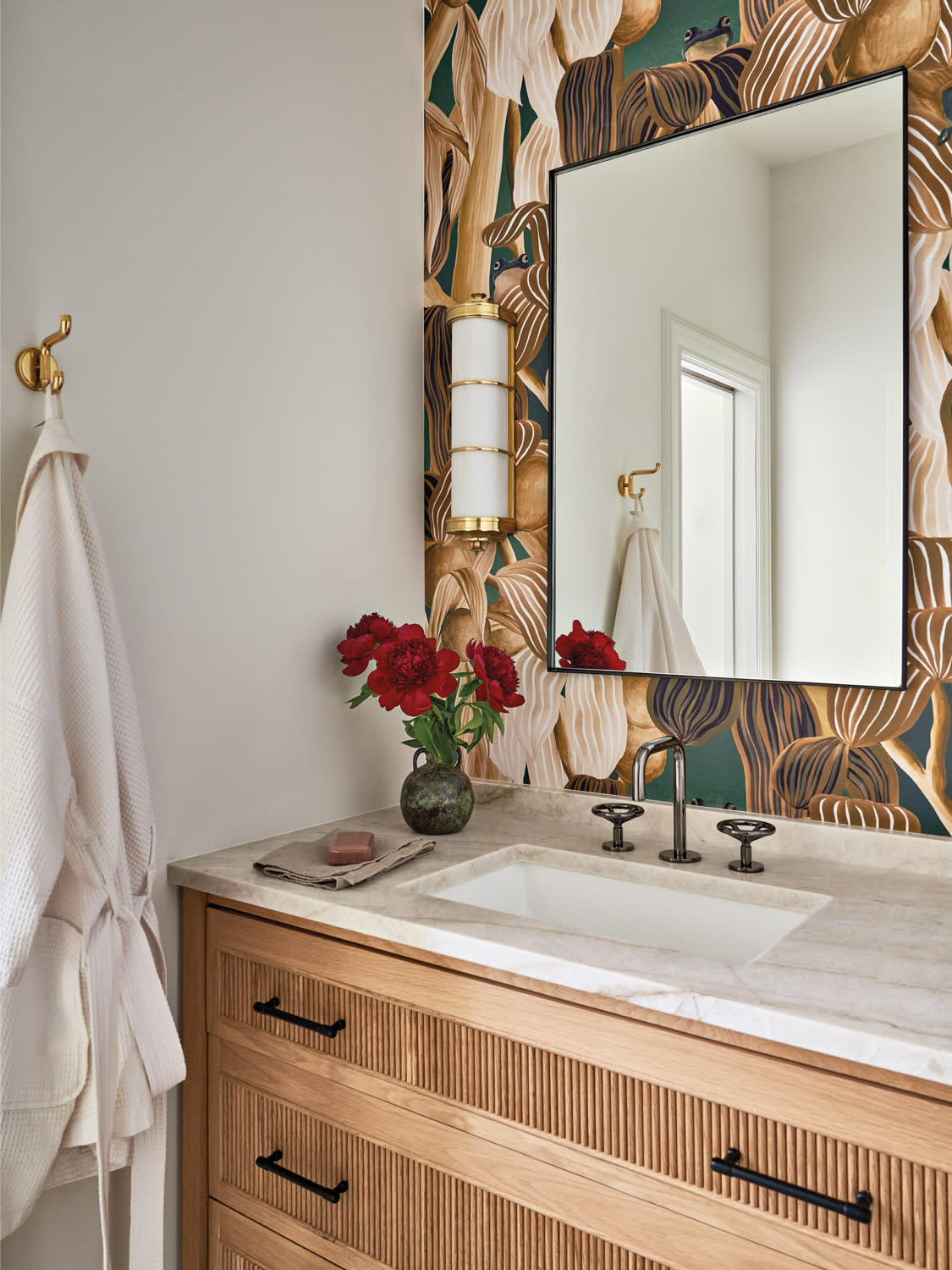 children's bathroom with a playful leaf and frog wallcovering