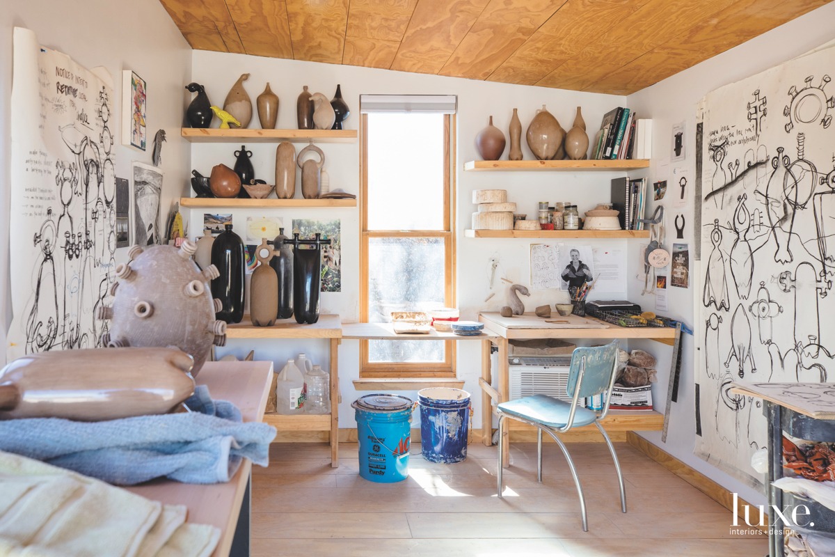 Ceramic vessels crowd the shelves in the Albuquerque studio of artist Jami Porter Lara.