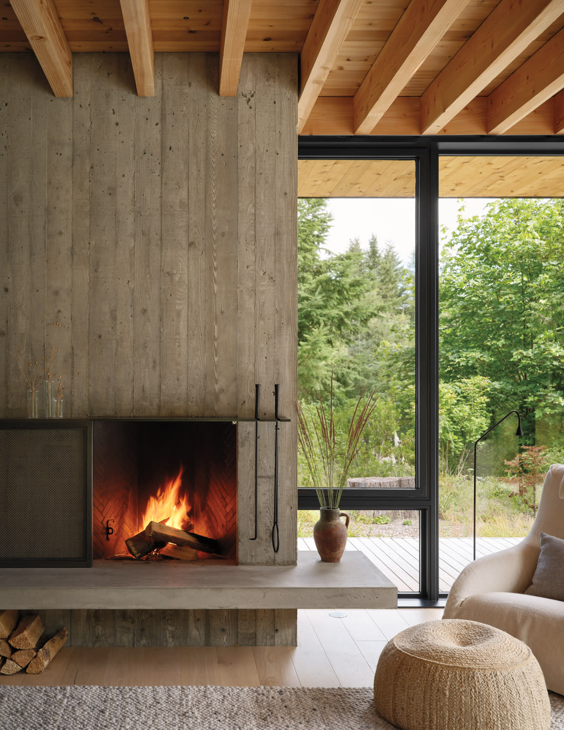 A sleek, modern fireplace in a contemporary living room, surrounded by minimalist decor and warm lighting.