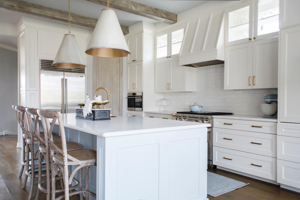 Coordinating wood tones and touches of dusty blue make for a stylish Country French inspired kitchen.