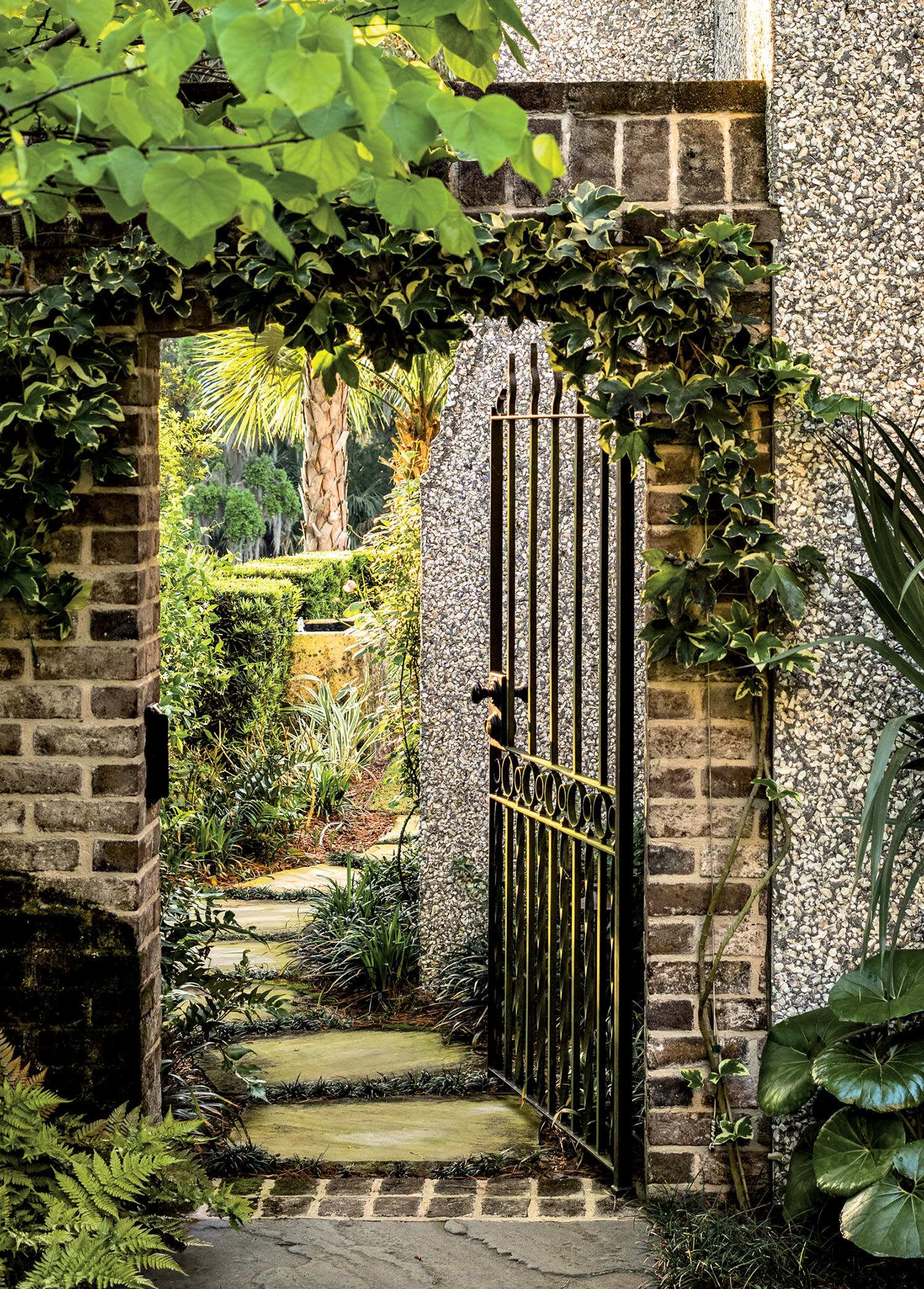 brick-framed gateway into a charming courtyard