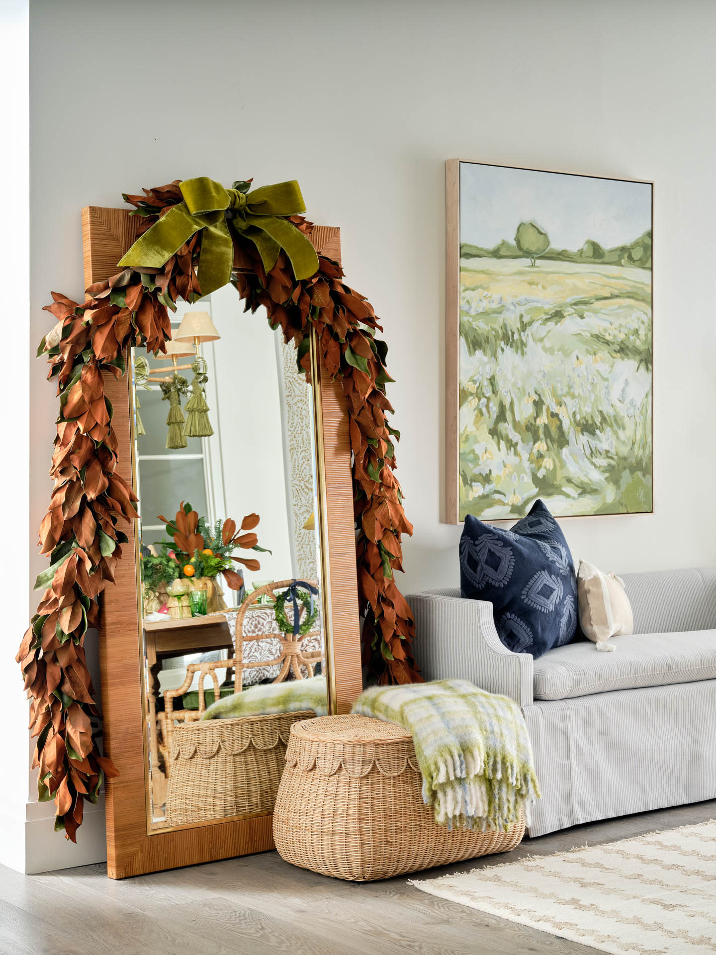 floor mirror wrapped with holiday garland