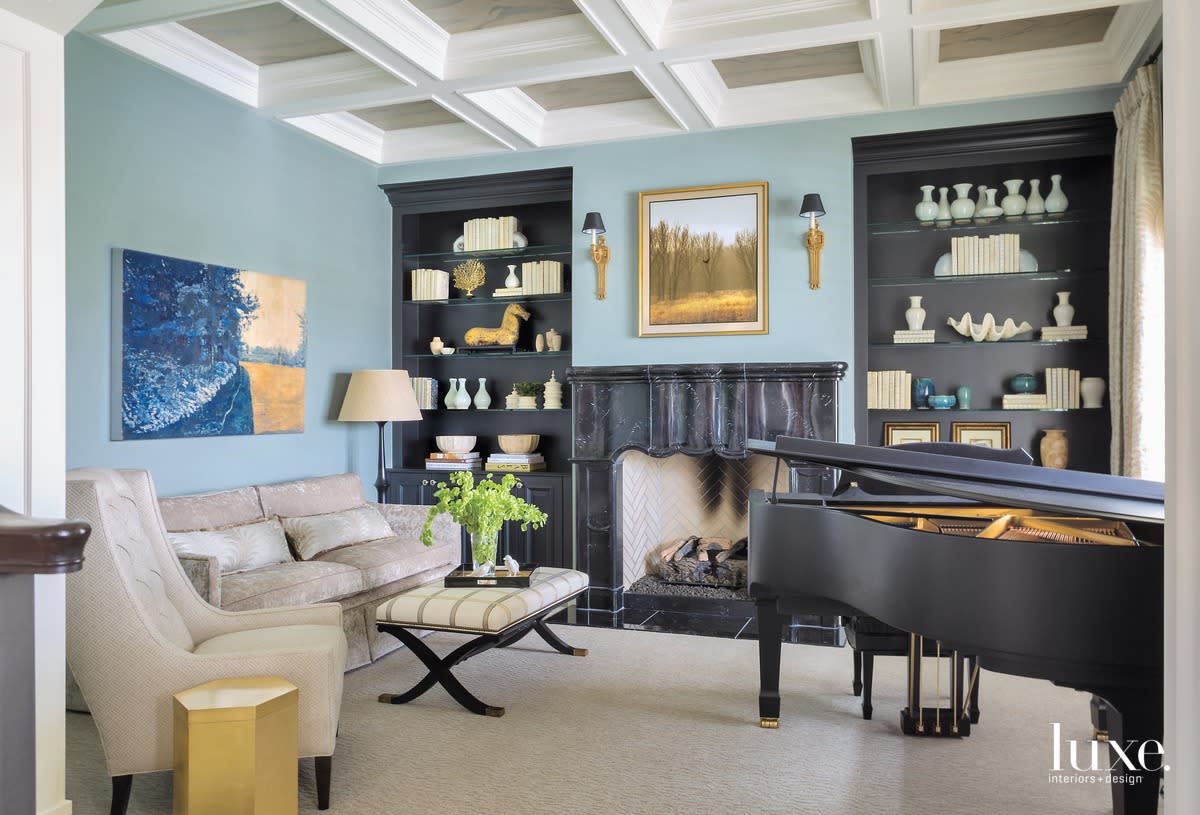 traditional living area music room blue walls black accents