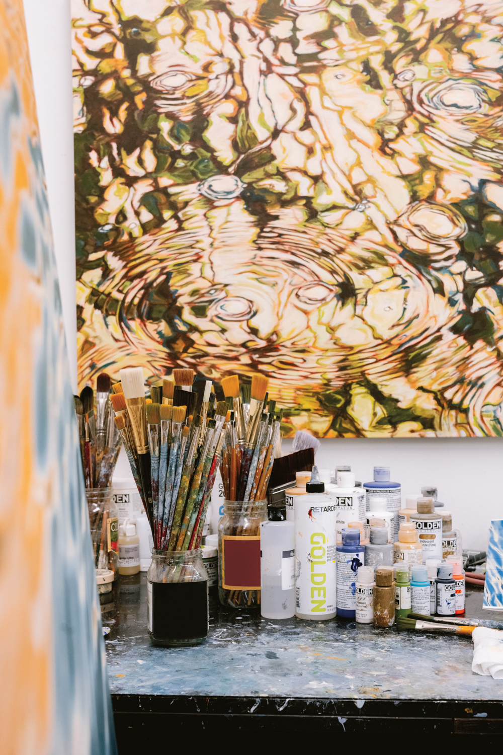 A painting hangs on the studio wall of Elizabeth Geisler