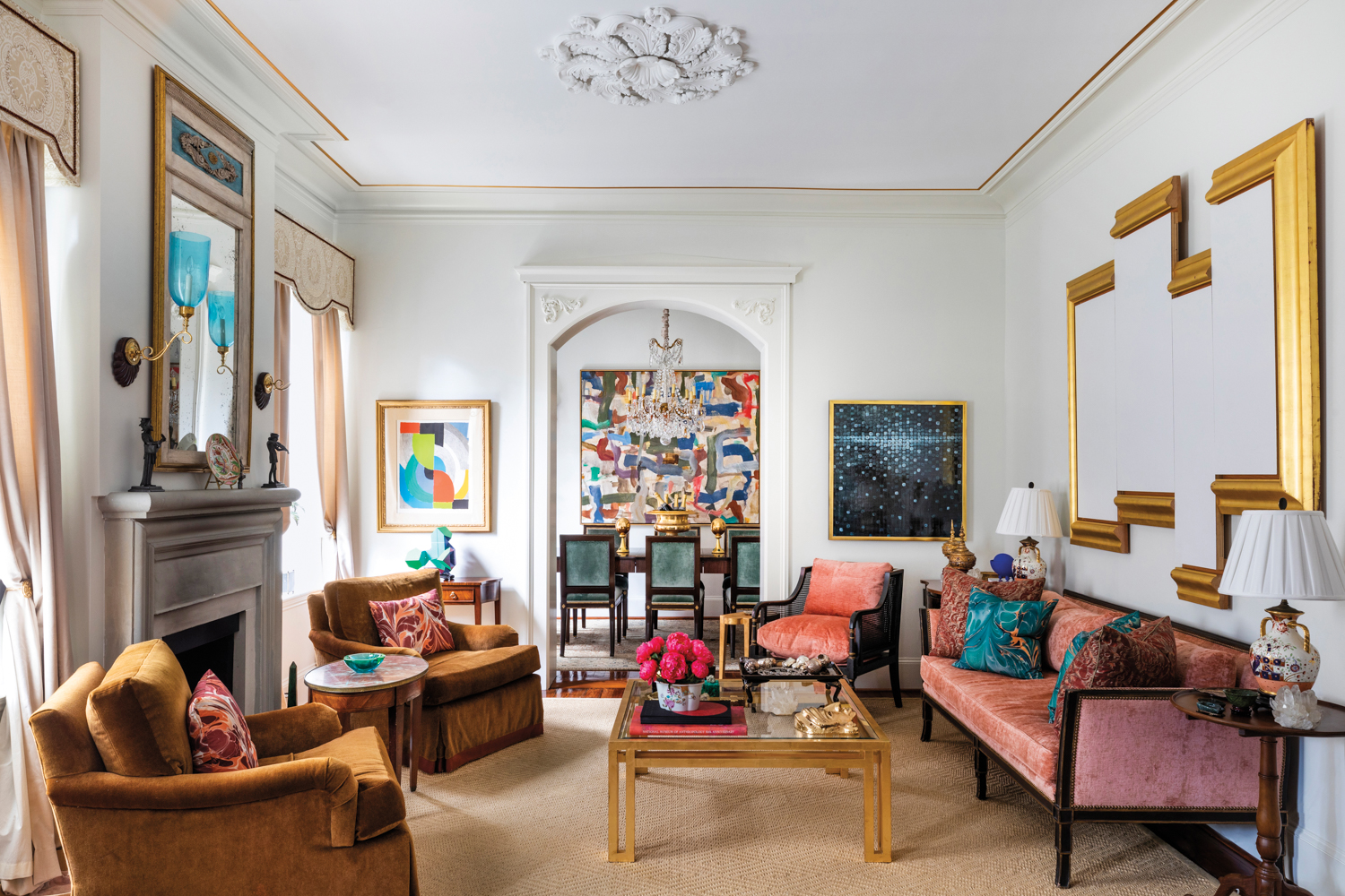 Traditional living room with high ceilings and colorful art