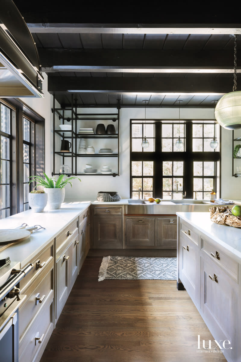 The kitchen has Venetian plaster walls and walnut cabinetry.