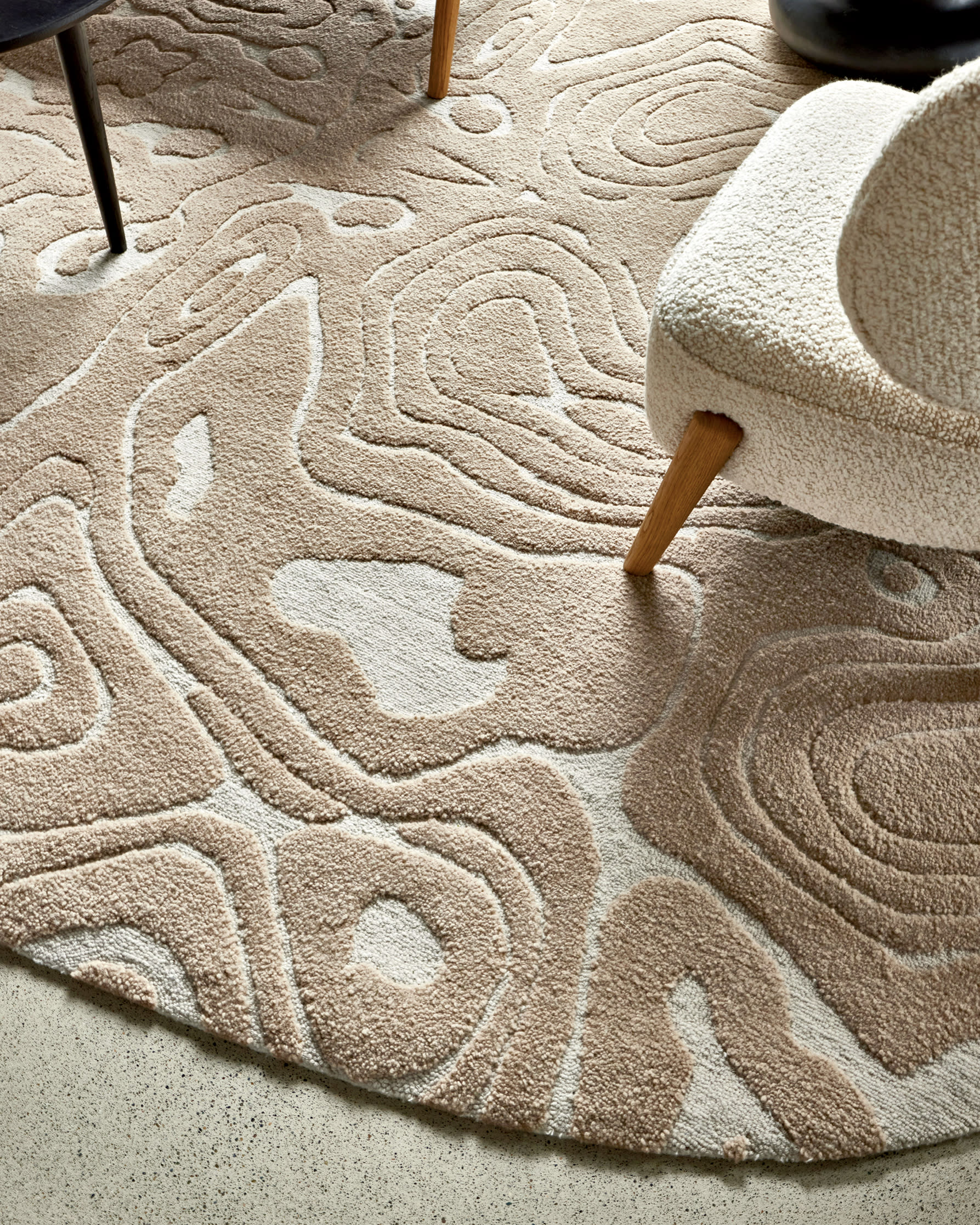 beige and off-white rug with textured amorphous shapes