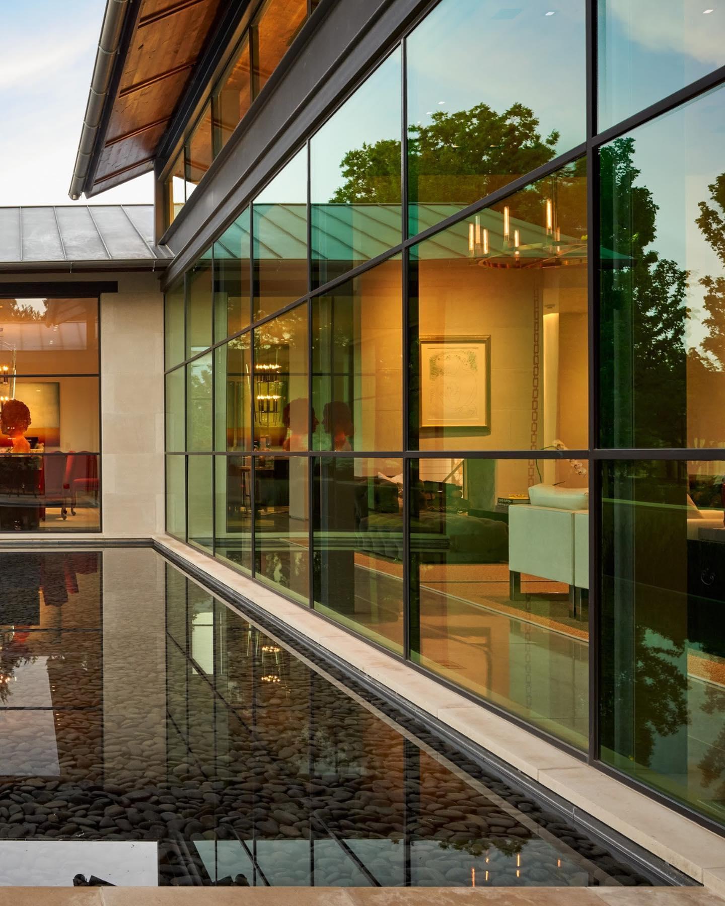 Floor to ceiling wall windows in modern house.
