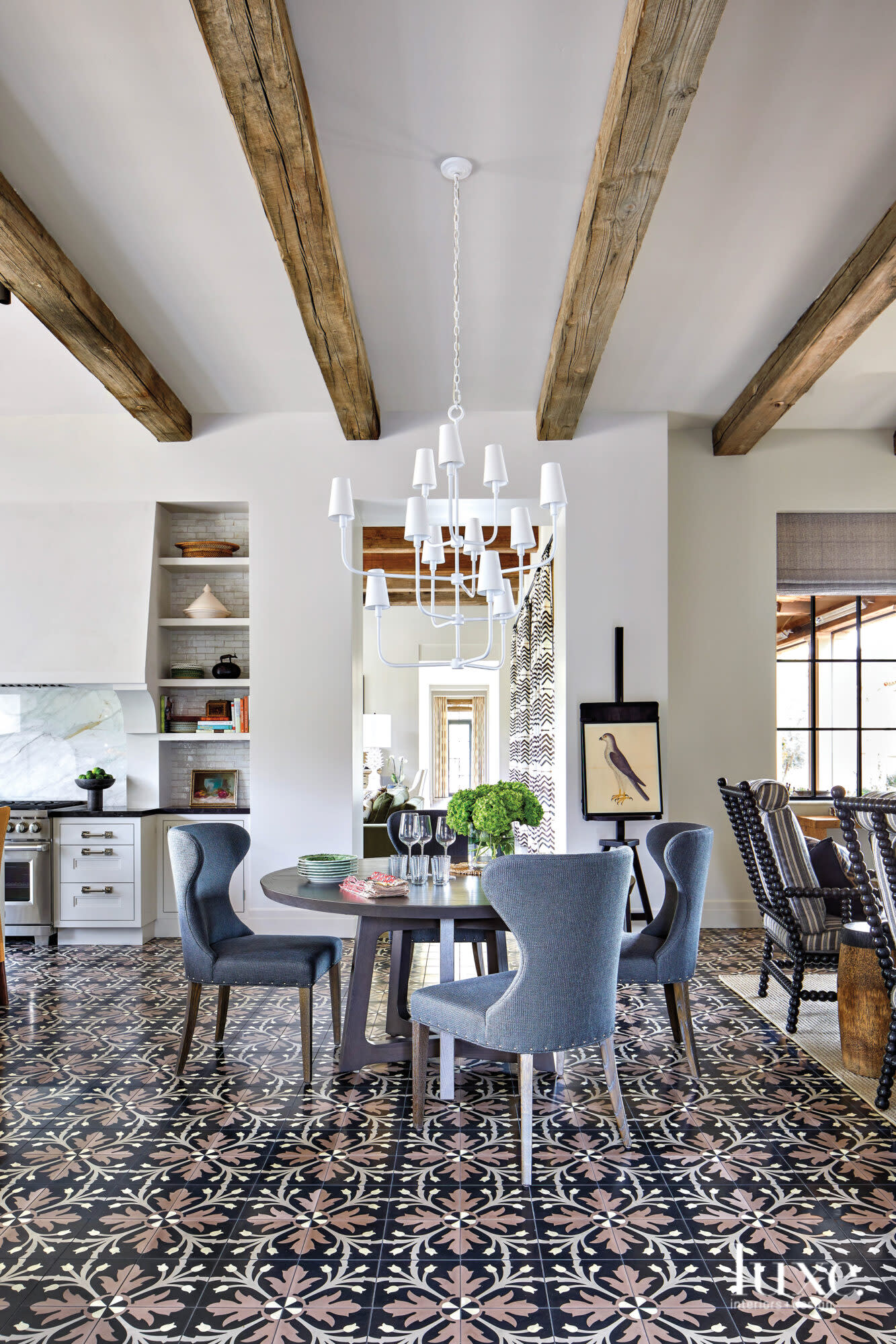 Black patterned tile draws the eye to the dining room floor