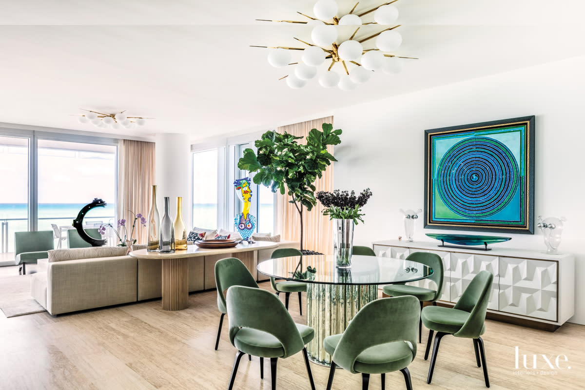 dining room with sage green velvet chairs