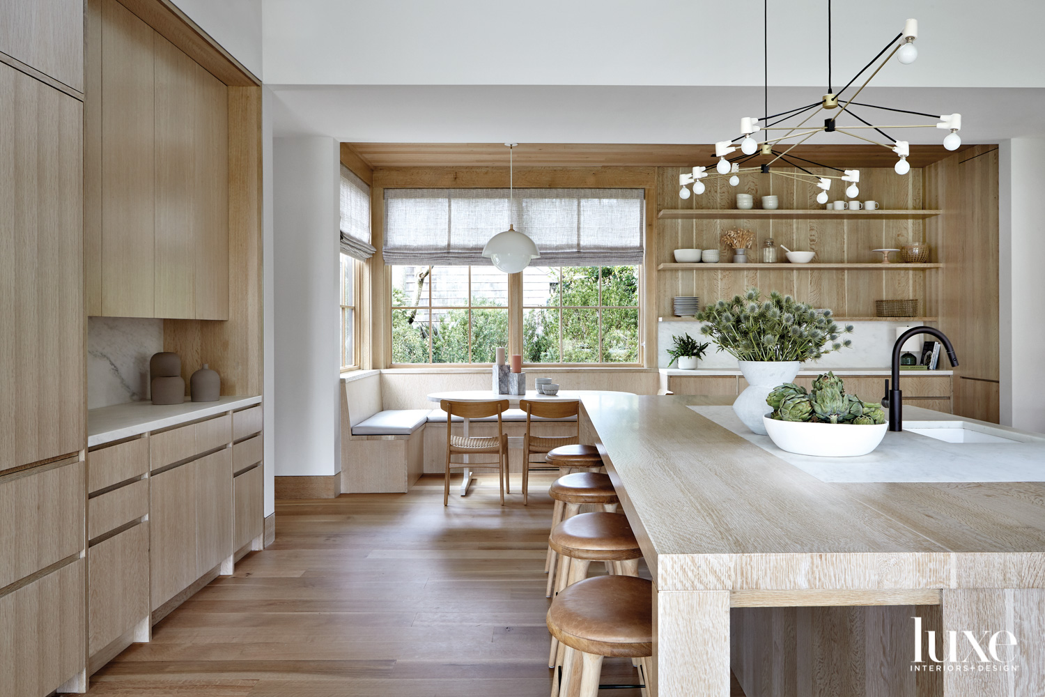 White oak island with bar stools