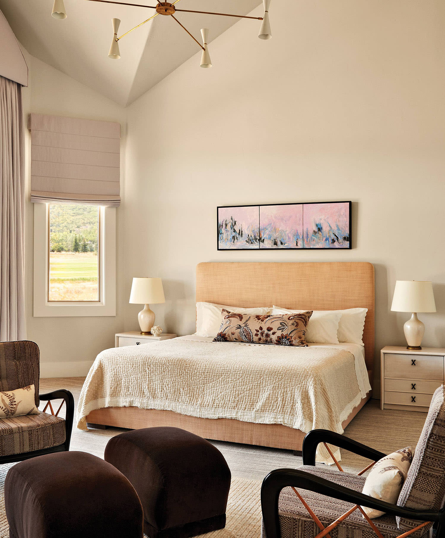 cozy bedroom with a mix of contemporary art and vintage finds