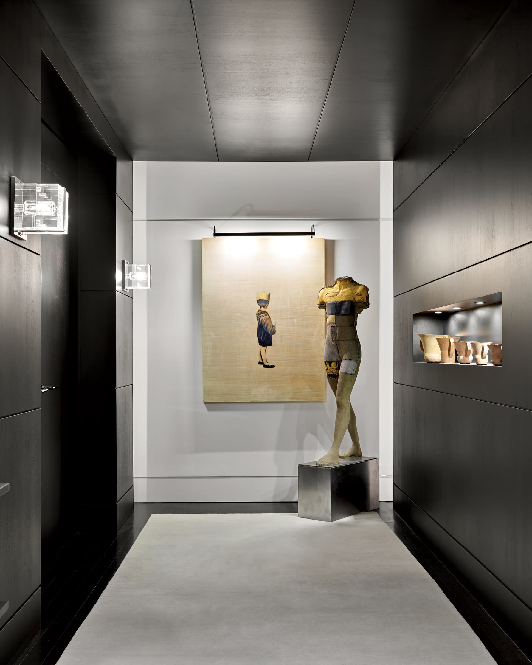 modern dark entryway with a Todd Murphy sculpture