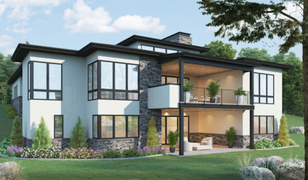 Rear exterior of modern two story home. White, Stone and black accents make this home standout. Plenty of outdoor space with balconies on both the lower and upper levels.