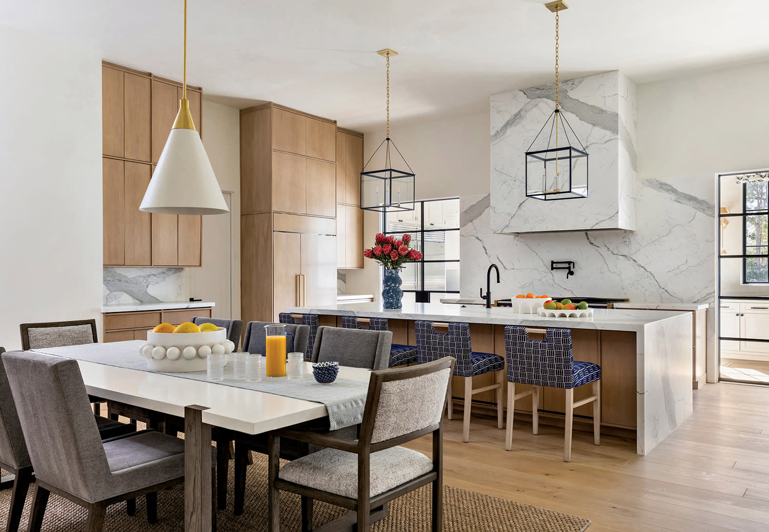 modern kitchen with Calacatta marble walls, hood, countertops and island
